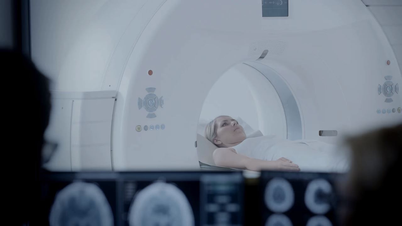 woman with brain injury being given ct scan