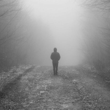 Man standing in fog