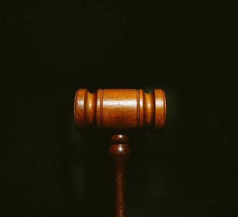 Gavel sitting on dark background